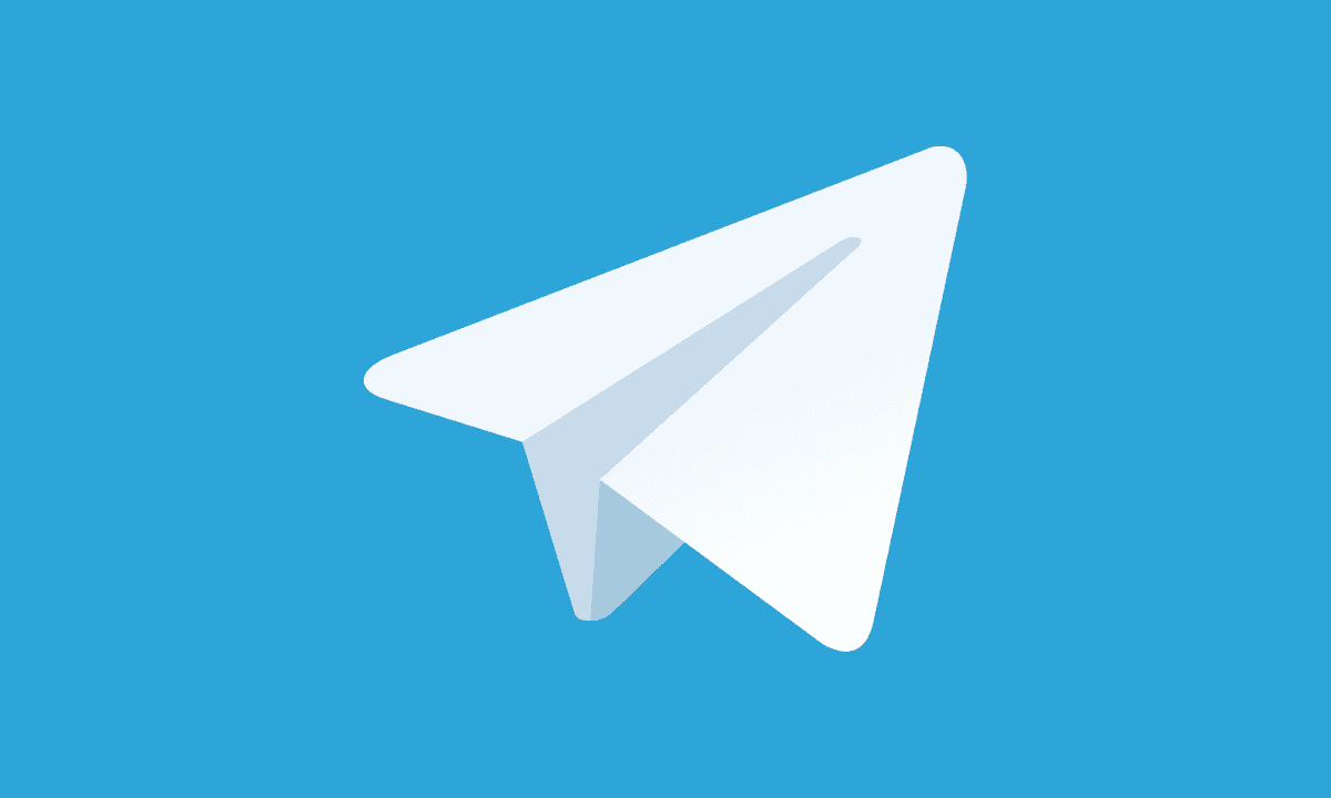 Icono de avión de papel blanco con fondo azul, que representa el logotipo de la app de mensajería Telegram.